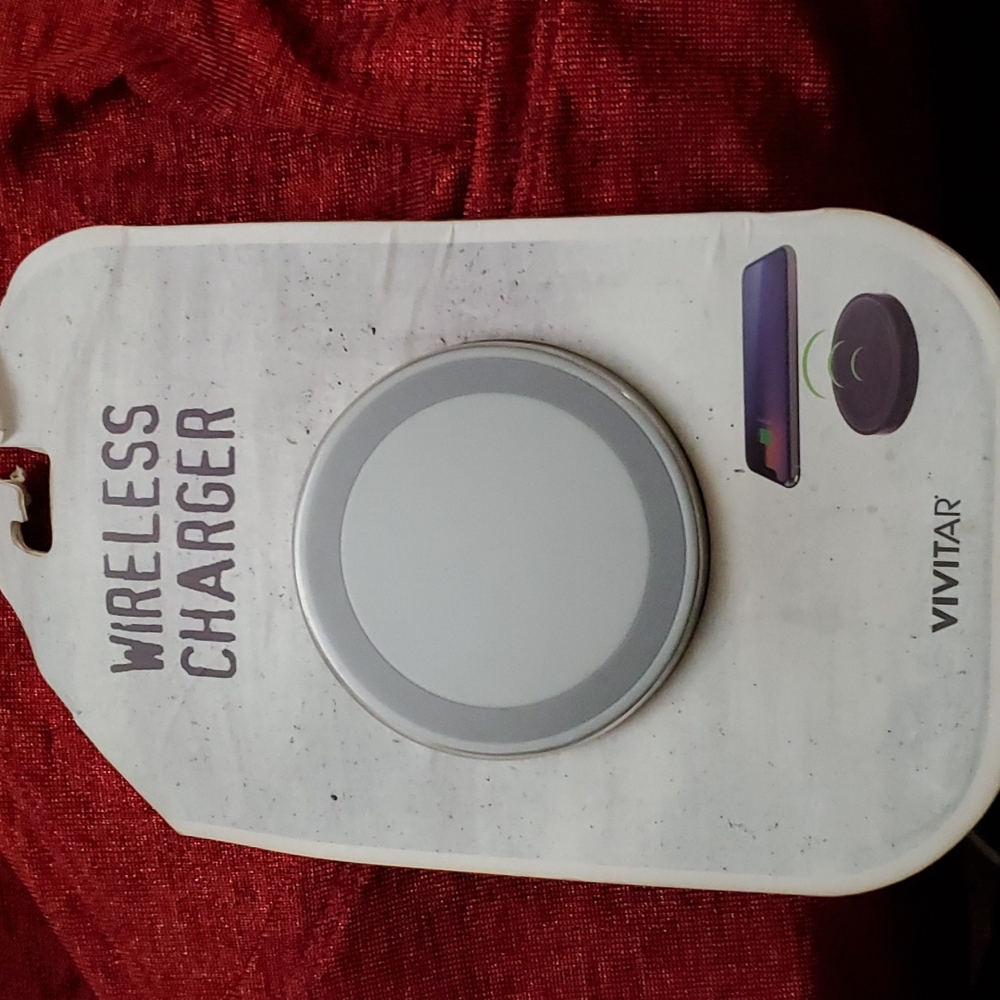 Vivitar Wireless charger! Brand new in package. Good on iPhone and Android.